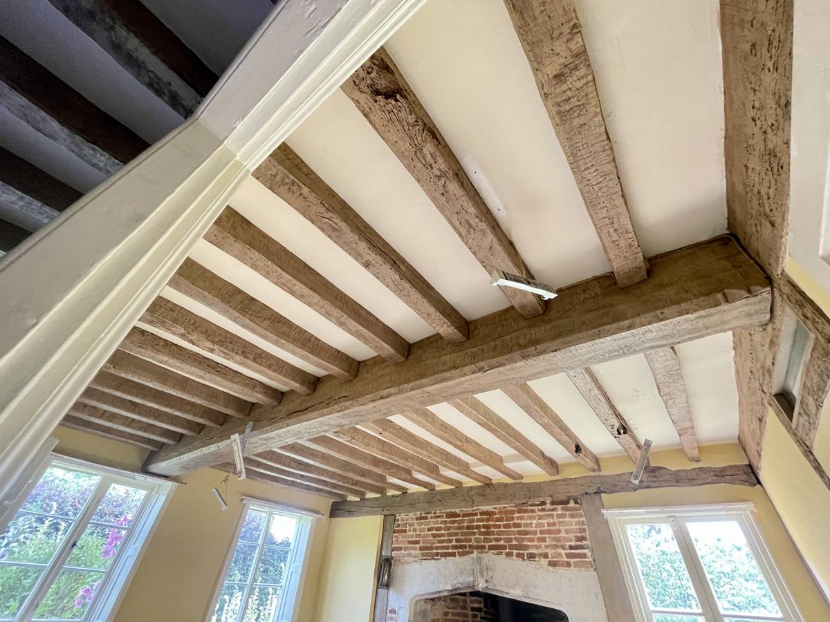 Closely spaced oak ceiling joists restored to a warm natural finish in a period house in West Malling, Kent